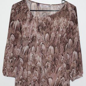 Jennifer Lopez Tan and brown top